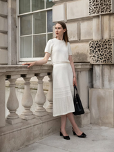 A woman wears a modest two-piece set